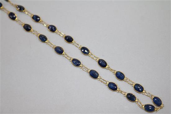 A 14ct gold and sapphire set spectacle necklace, 51cm.